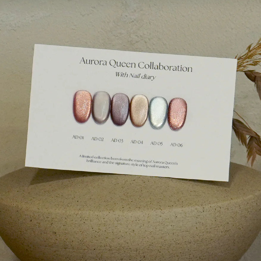 Stone pedestal with a card displaying nail color swatches on a neutral background